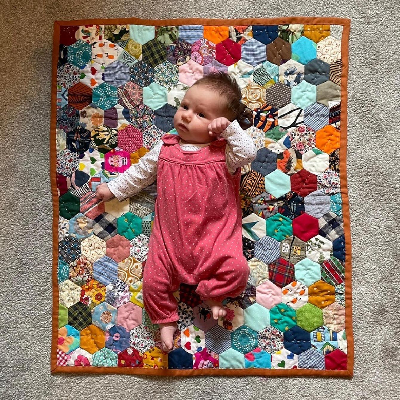 Photo of patchwork quilts and babies